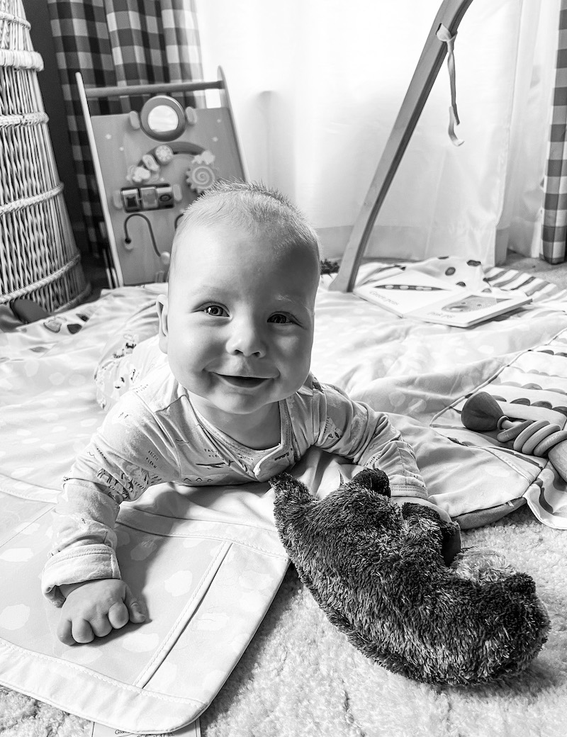 James playing with the Lovevery play gym