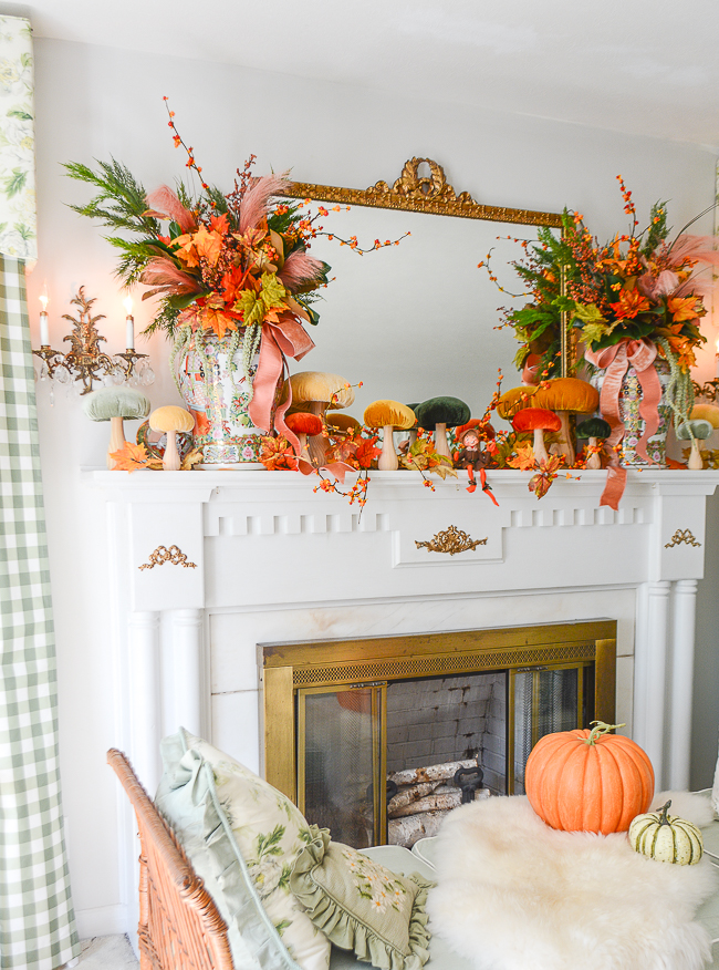 Fall floral arrangement in Rose Medallion temple jars with velvet mushrooms decorate this traditional mantel for fall