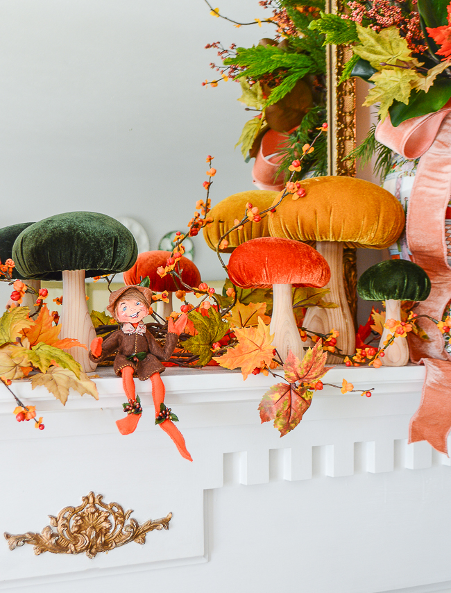 Annalee autumn elf sits on the mantel shelf waiting to enchant you