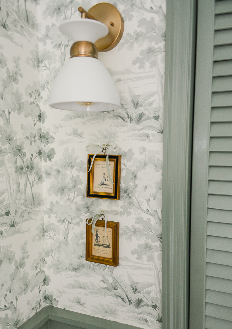 Sconce and art in woodland themed nursery - practical nursery design