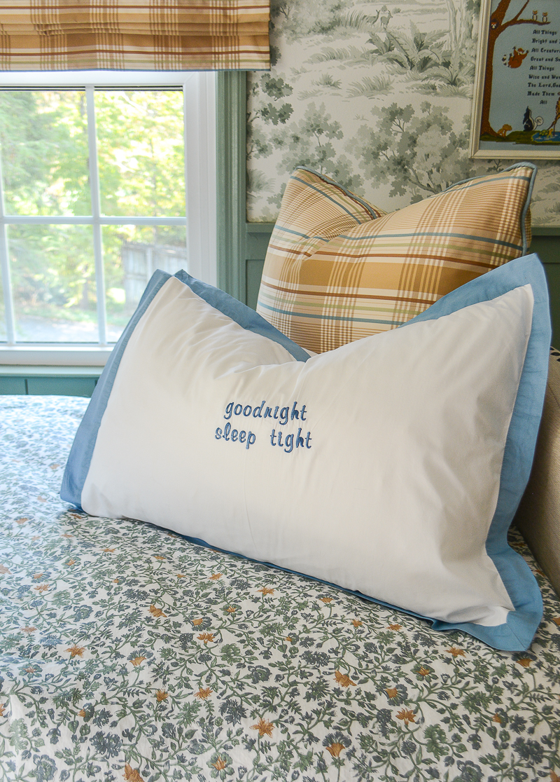 "goodnight, sleep tight" embroidered pillow in boy's nursery for a whimsical touch