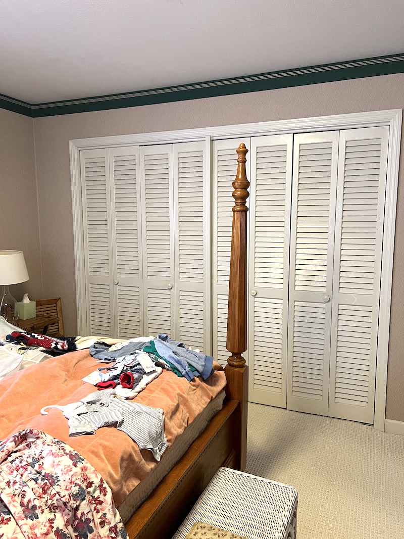 The outdated and cluttered bedroom - closet view- we turned into a bright woodland themed nursery for our baby boy