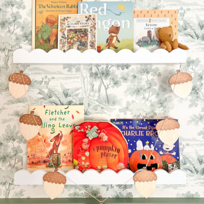 Our fall story shelves for James decorated with acorn garland