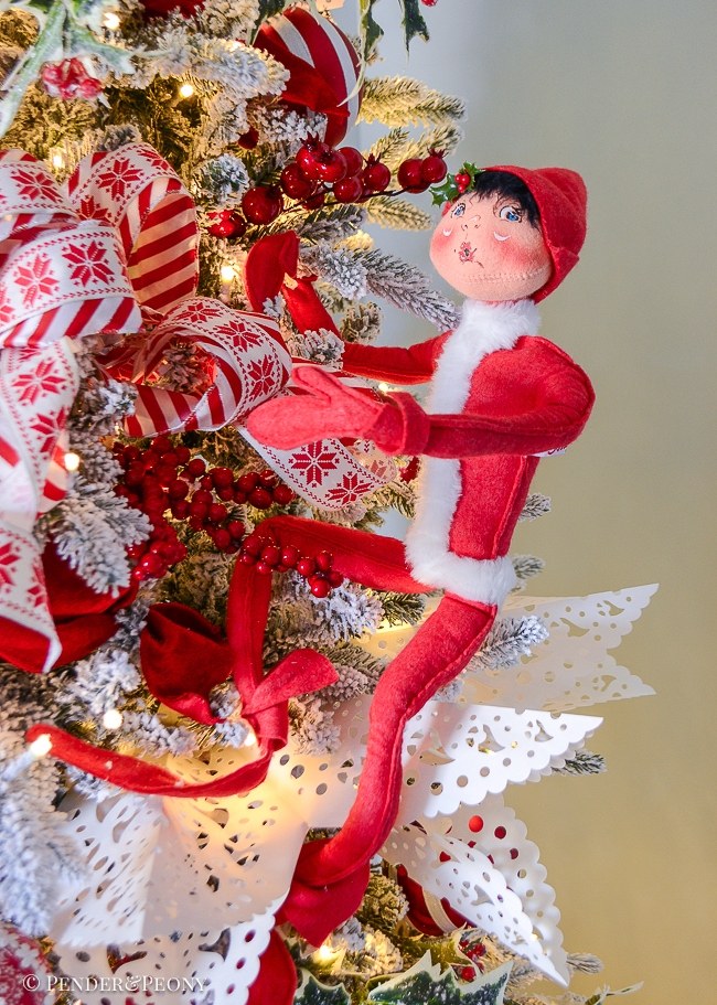 Annalee elf climbing the red and white Christmas tree