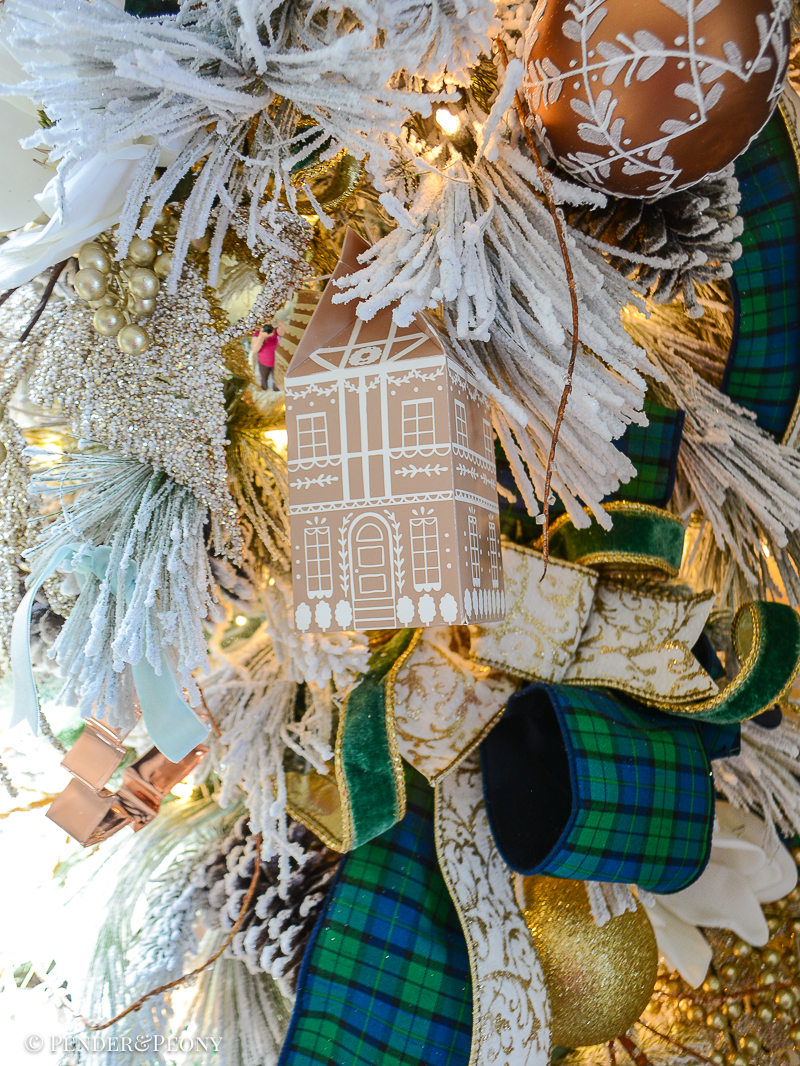 Gingerbread house box hung as ornament on Christmas tree