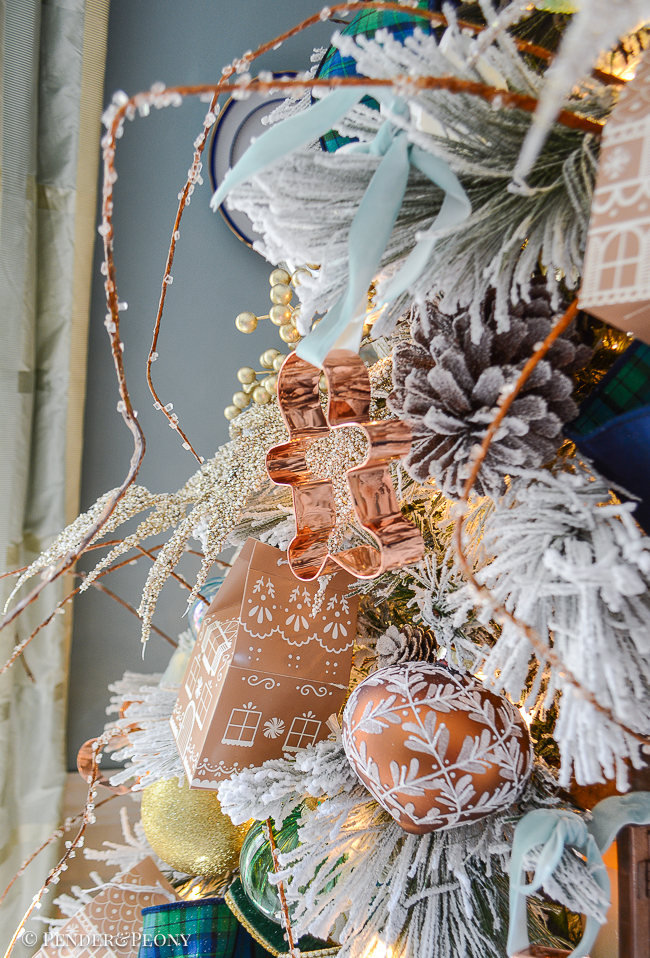 copper cookie cutter gingerbread man hung as ornament on Gingerbread Forest Christmas tree