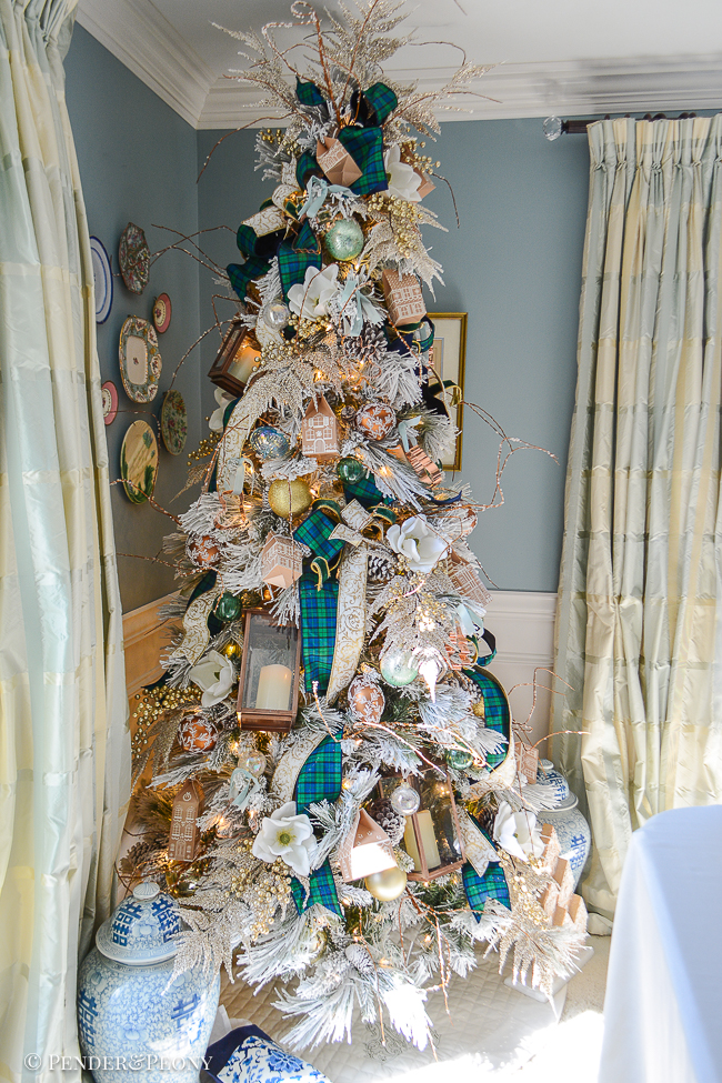 My gingerbread forest Christmas tree with Black Watch plaid ribbon, magnolia, copper lanterns, cookie cutters, and gingerbread houses