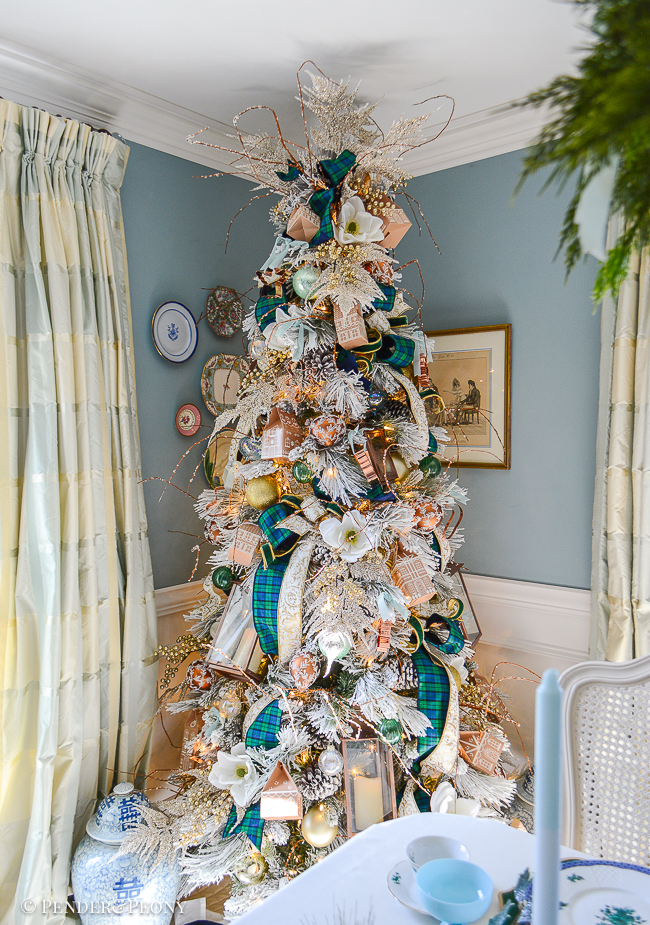 My gingerbread forest Christmas tree with Black Watch plaid ribbon, magnolia, copper lanterns, cookie cutters, and gingerbread houses
