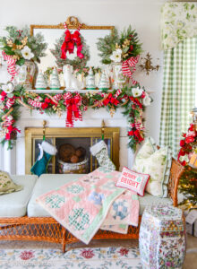 Katherine's formal living room mantel decorated with jolly blossoms Christmas decor: magnolia, holly, pink velvet, red gingham, Rose Medallion