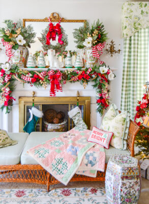 Katherine's formal living room mantel decorated with jolly blossoms Christmas decor: magnolia, holly, pink velvet, red gingham, Rose Medallion