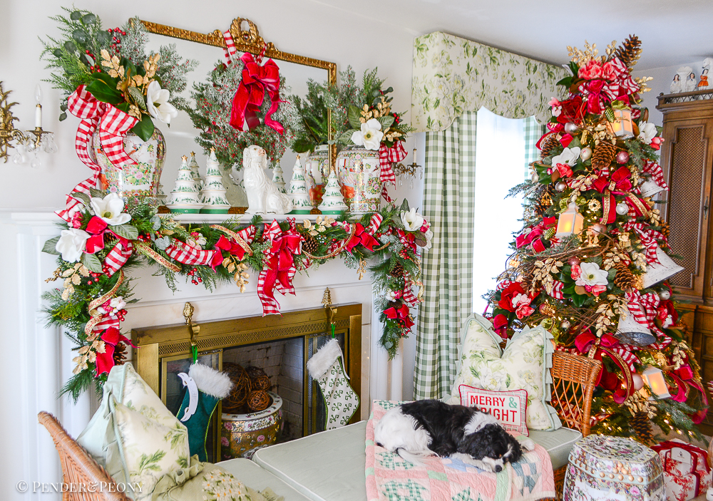 Jolly blossoms Christmas decor in green and white formal living room with pink and red decorations, gingham, magnolia, holly, and Rose Medallion