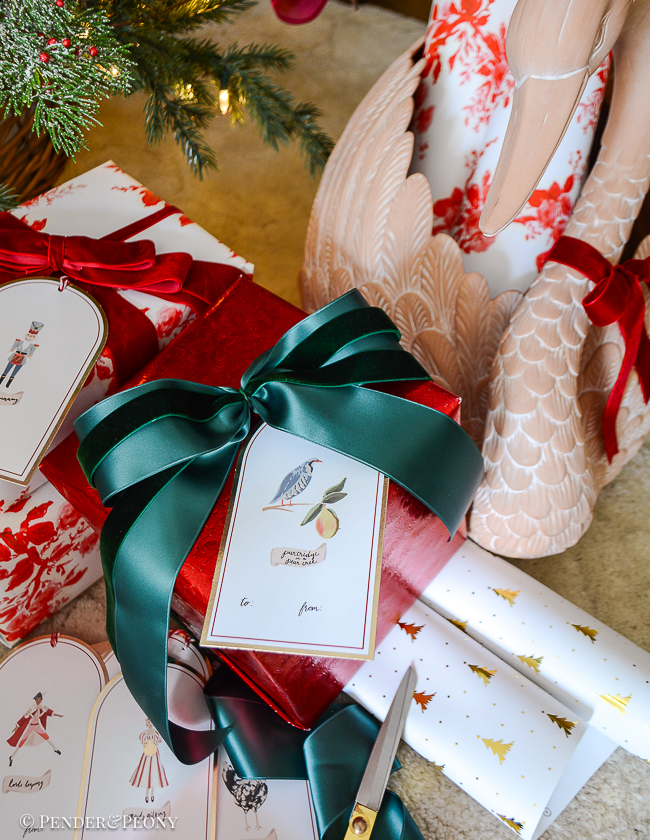Red and green wrapped presents with "12 Days of Christmas" gift tags