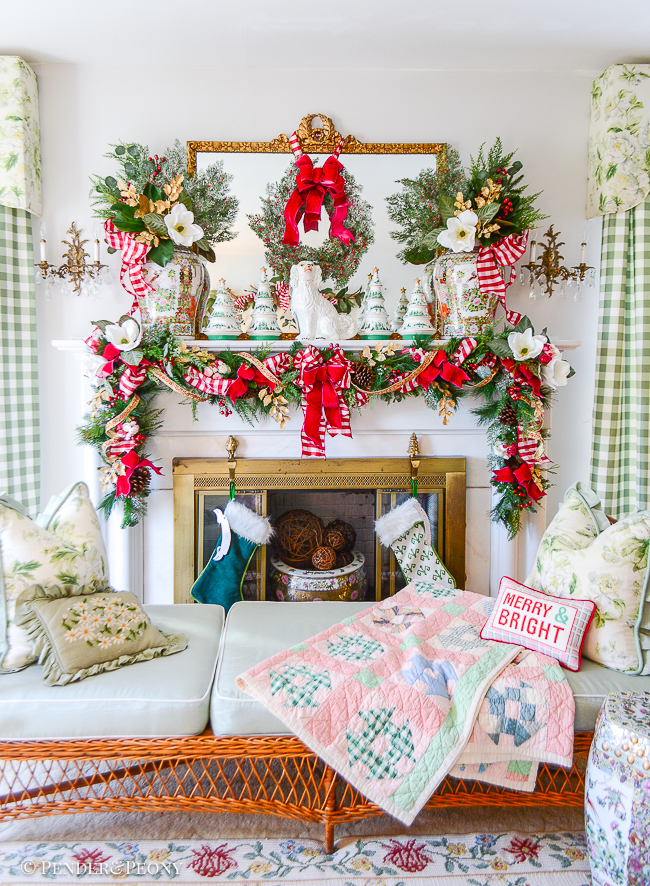 Jolly Blossoms Christmas garland hung on mantel and tied up with pink velvet bows