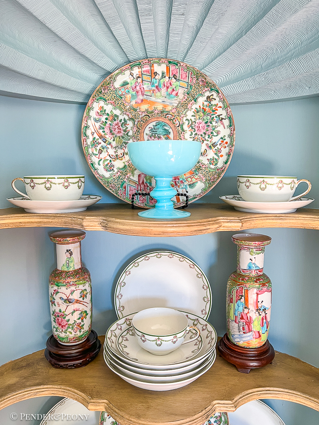 Rose Medallion plates and vases compliment the Limoges bowls on this hutch