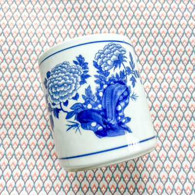 A timeless blue and white brush pot with peony design.