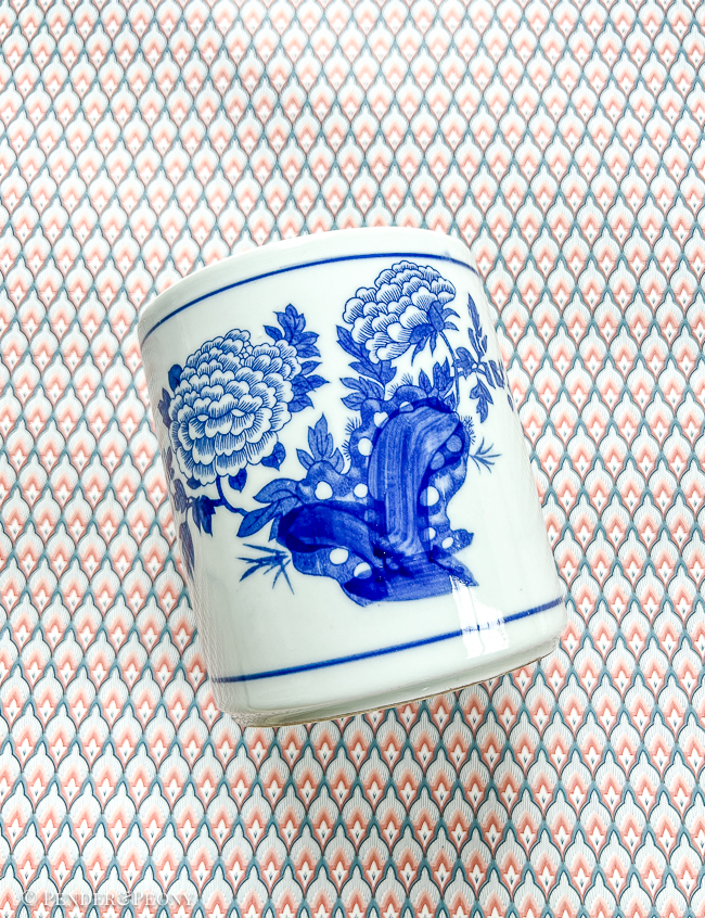 A timeless blue and white brush pot with peony design.