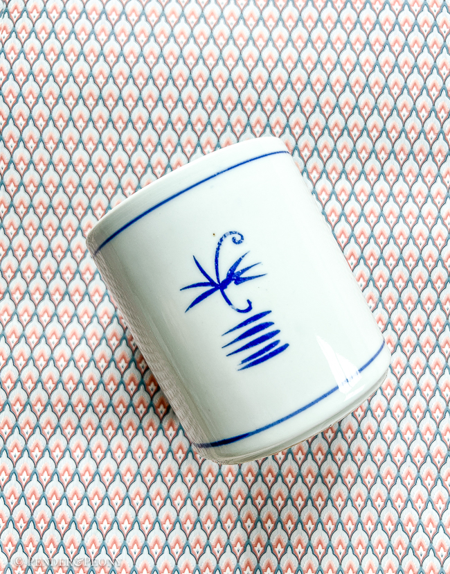 A timeless blue and white brush pot with peony design.