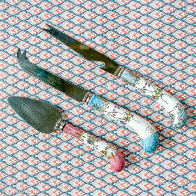 Beautiful floral porcelain handled cheese knives. Sheffield, Stainless.