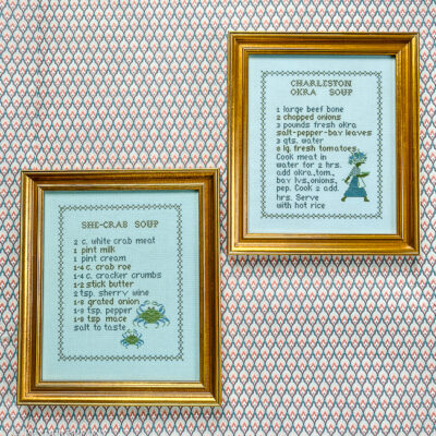 Pair of Low Country recipe cross stitches in vibrant blue and green.
