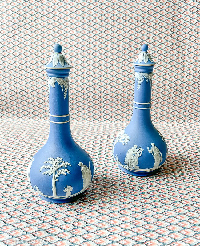 Classic blue and white Wedgwood Jasperware bottles with lids.