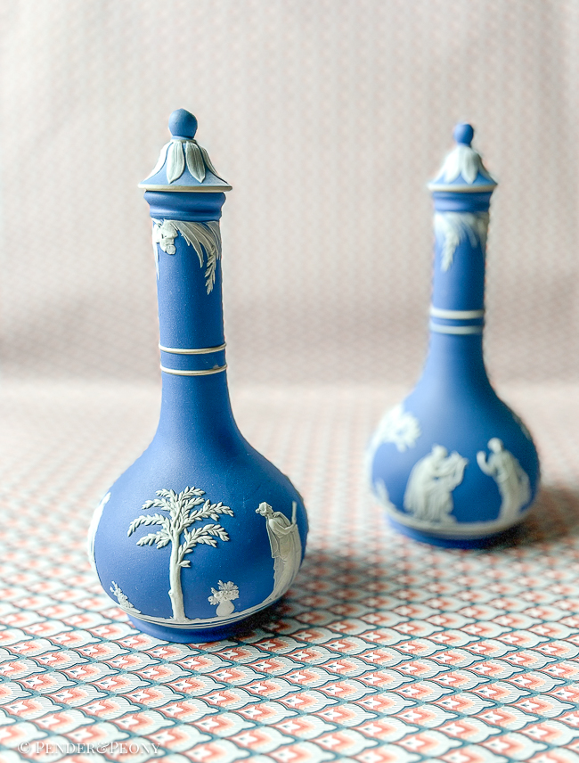 Classic blue and white Wedgwood Jasperware bottles with lids.