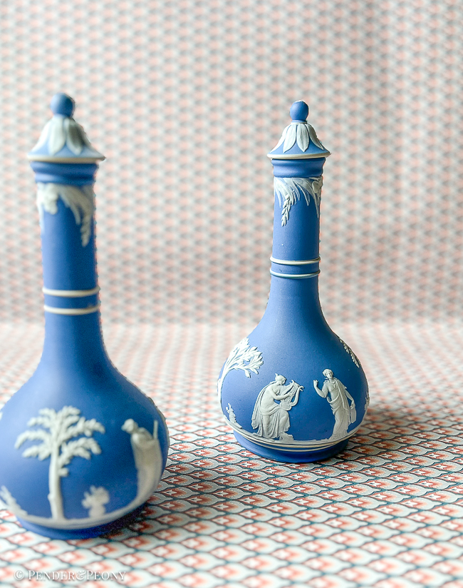 Classic blue and white Wedgwood Jasperware bottles with lids.