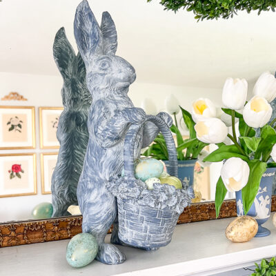 Blue bunny with floral basket - made from resin - decorating Easter mantel
