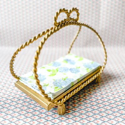 Gilt hand towel holder for the powder room.