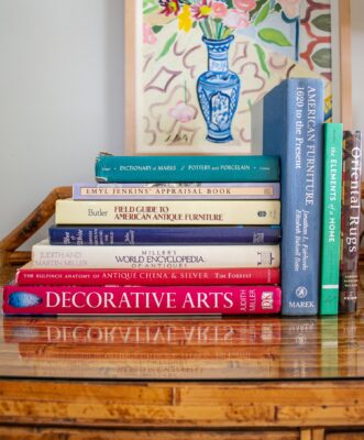 Stacks of resource books for collecting antiques