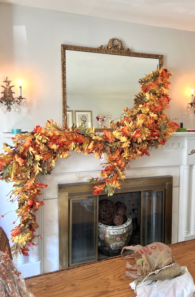 Beginning of fall mantel garland with oak leaf and bittersweet base garlands
