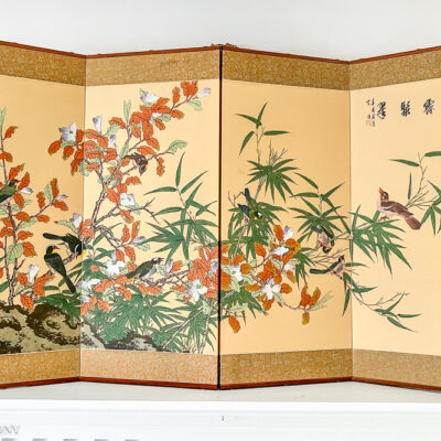 A vivid painting of birds flitting amongst a bamboo forest on this Japanese style 4-panel byobu.
