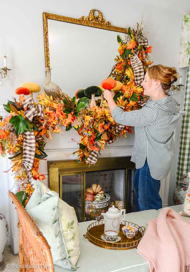 Katherine places velvet mushroom on autumn mantel