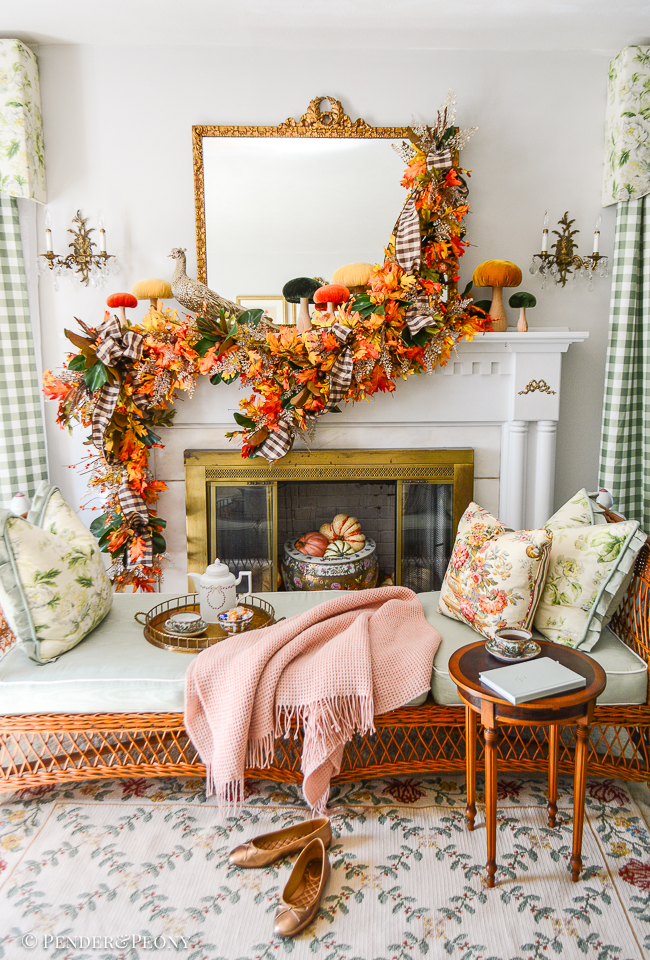 Decorate your mantel with a gorgeous garland of oak leaves, bittersweet, fern, magnolia, and gingham ribbon
