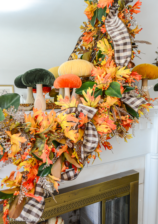 Velvet mushrooms add whimsy to this autumn mantel decor