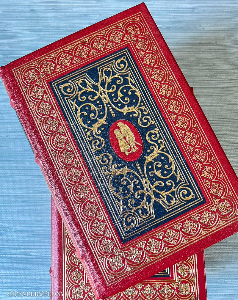 A Victorian bibliophile’s dream set in stunning red and navy leather with lavish gilt detailing.
