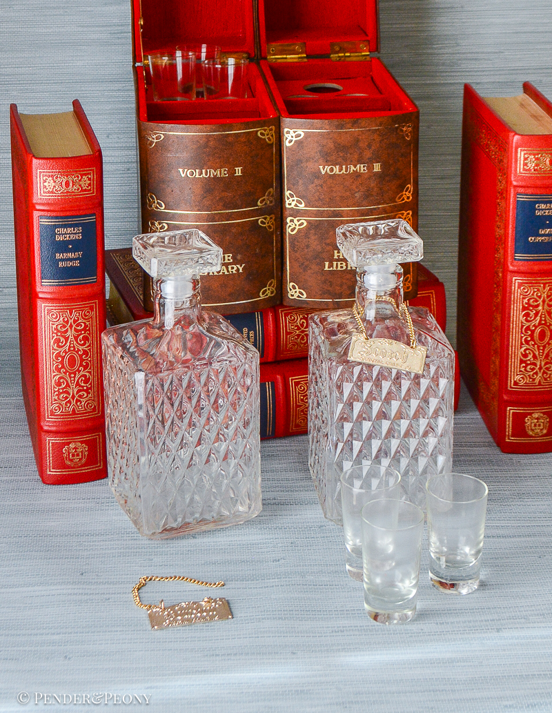 Add a chic little hideaway bar to your bookshelves or table with this faux book tantalus.