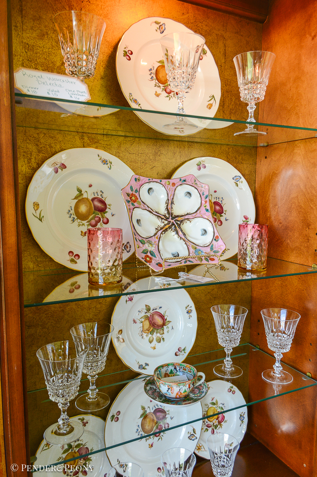 Styled shelves inside china cabinet