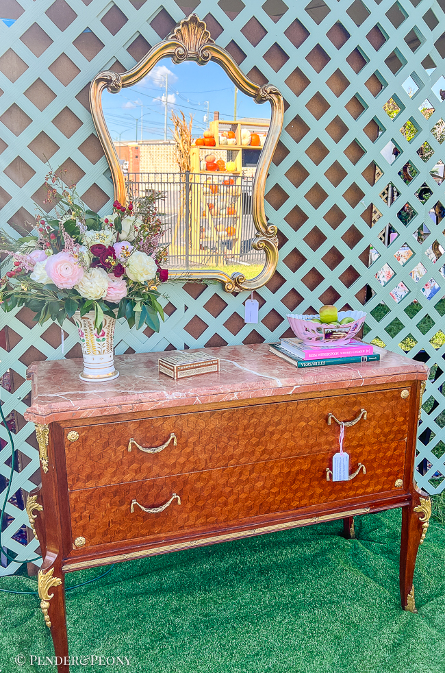 Exterior wall of tent with French Louis XV/XVI transitional commode