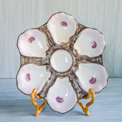 Brown and pink oyster shell plate with impressed mark 765, typical French Limoges mark. Late 19th century.