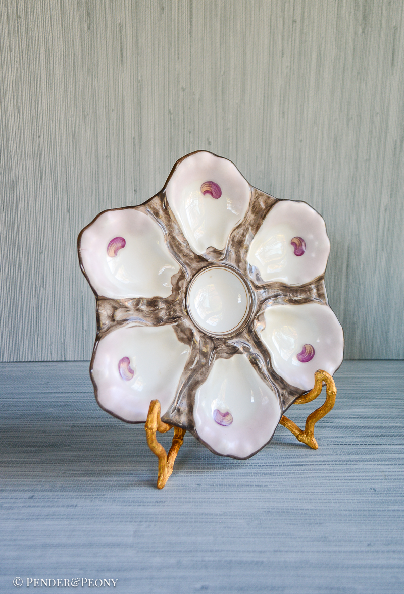 Brown and pink oyster shell plate with impressed mark 765, typical French Limoges mark. Late 19th century.