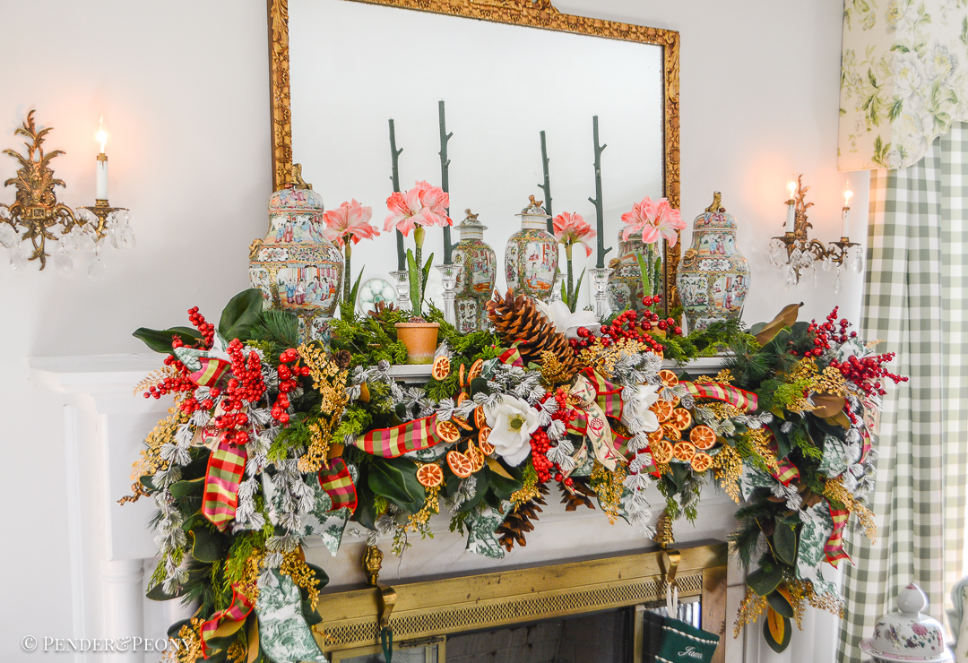Christmas garland idea - Grand Botanical look for a lush Christmas garland on the mantel with magnolia, cedar, pine, red berries, dried oranges, gold fern, and sugar pine cones.