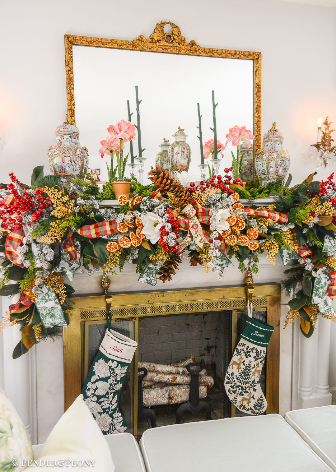 Christmas garland idea - Grand Botanical look for a lush Christmas garland on the mantel with magnolia, cedar, pine, red berries, dried oranges, gold fern, and sugar pine cones.