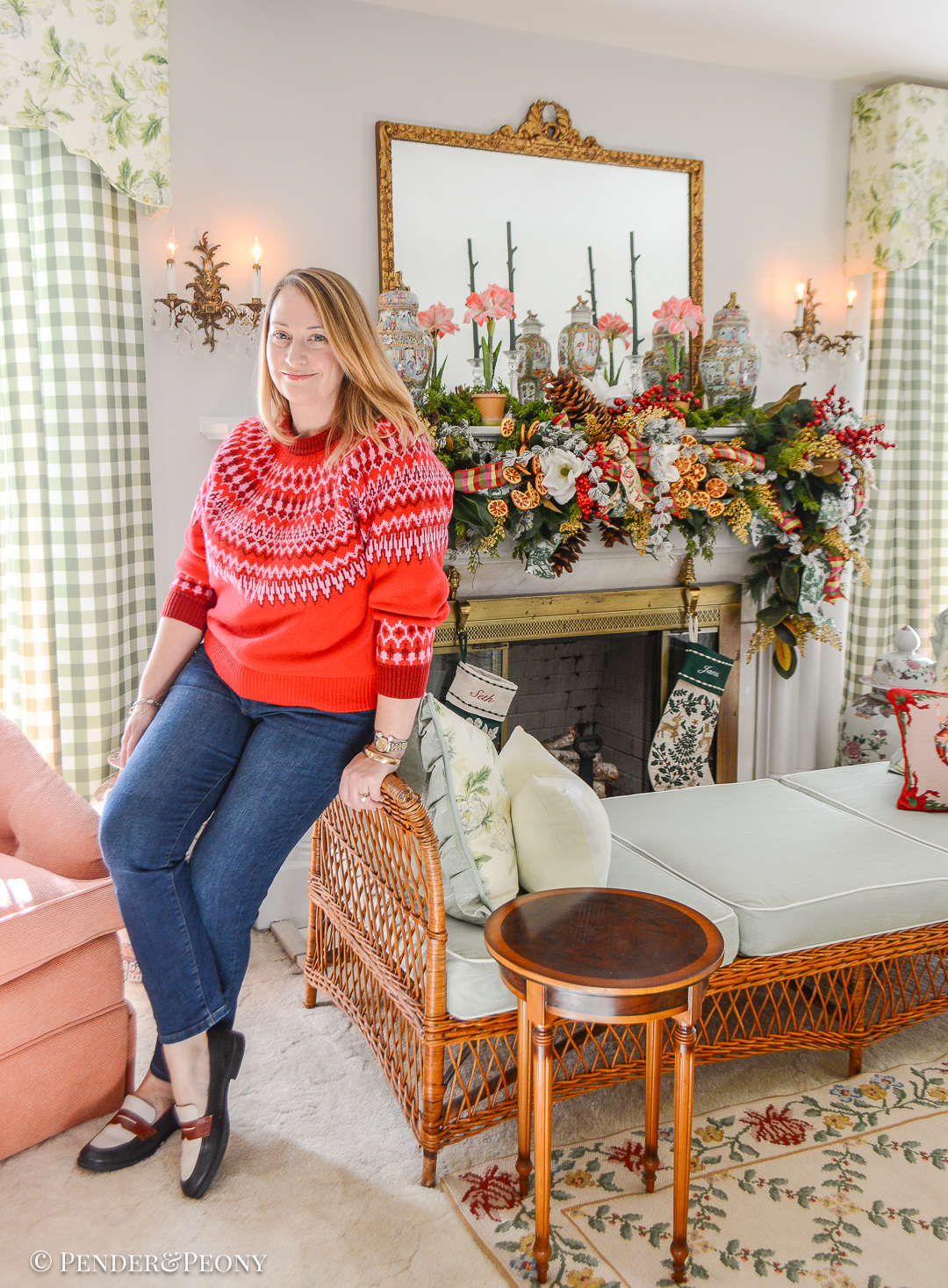 Katherine poses in front of her Christmas garland DIY