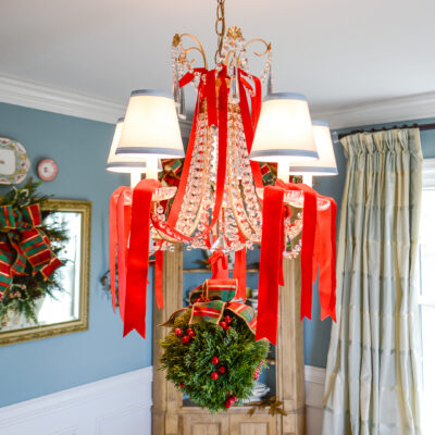 Faux cedar kissing ball with red berries and plaid bow