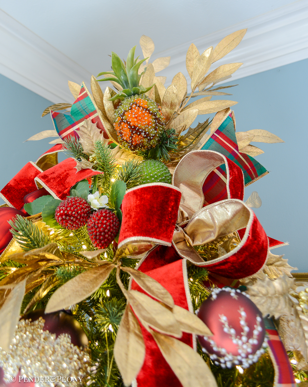 A vintage beaded pineapple tops Katherine's fruity Christmas tree in the dining room