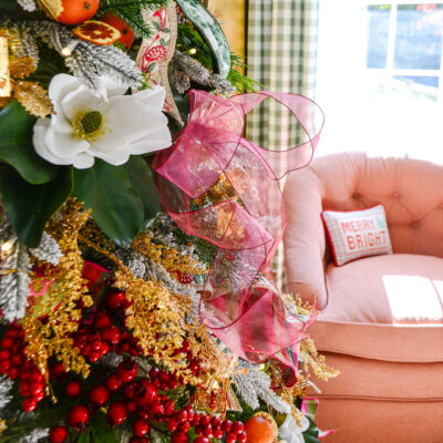 A look at my Grand Botanical Christmas tree decorated with magnolia, florals, embroidered bows, gingham ribbons, pink and green, and orange pomanders
