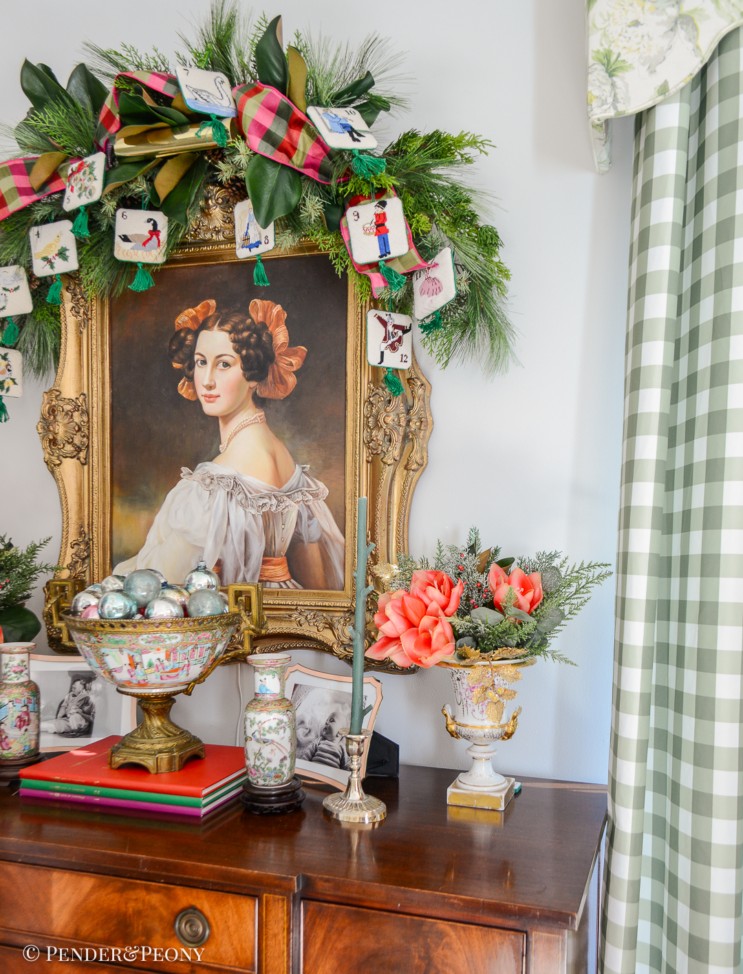 Festive touches: Evergreen swag with needlepoint ornaments hung over portrait and sideboard decorated with Chinese and French porcelains holding Christmas florals and ornaments