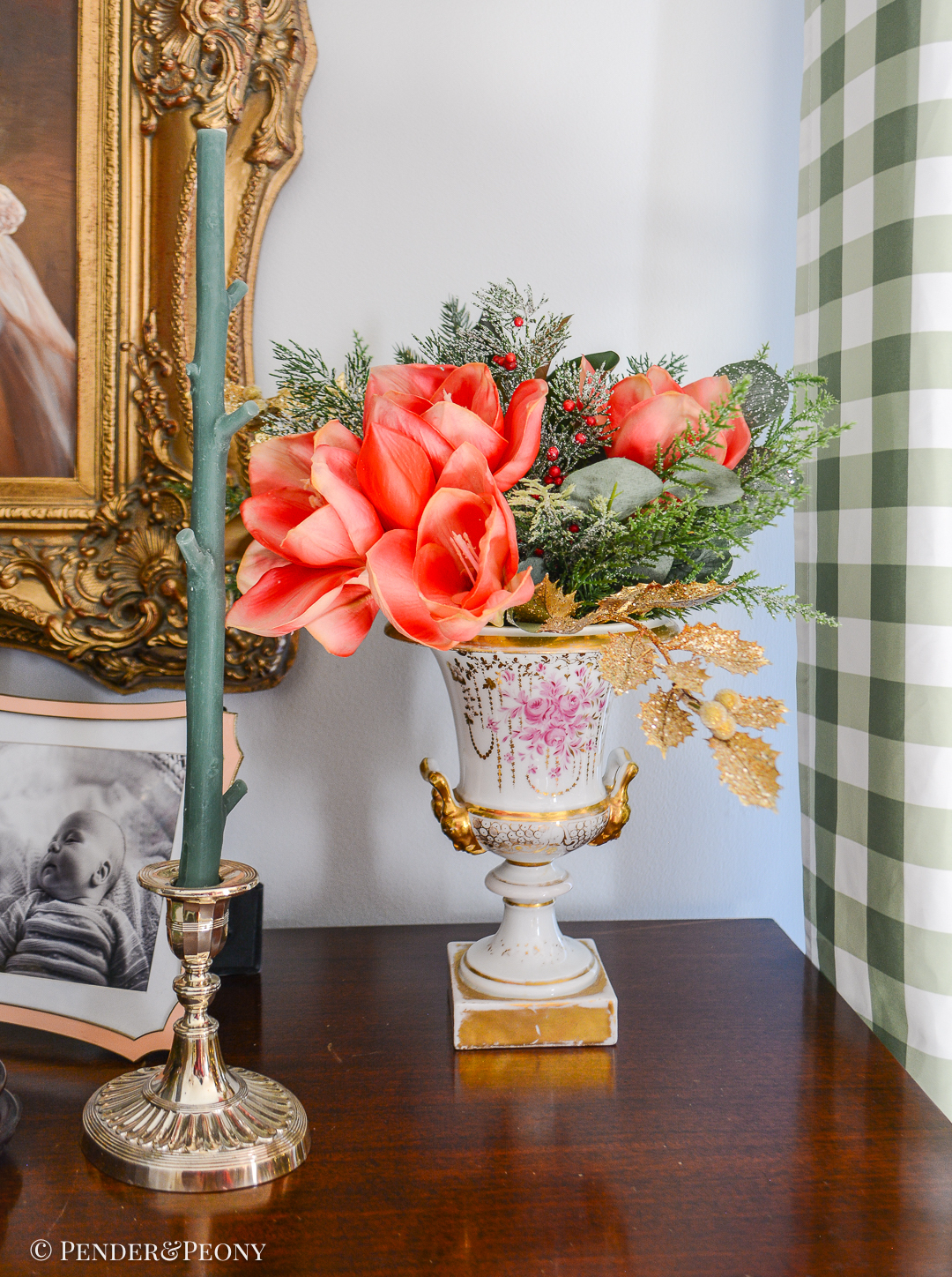 Amaryllis, pine, cedar arranged in Old Paris urn