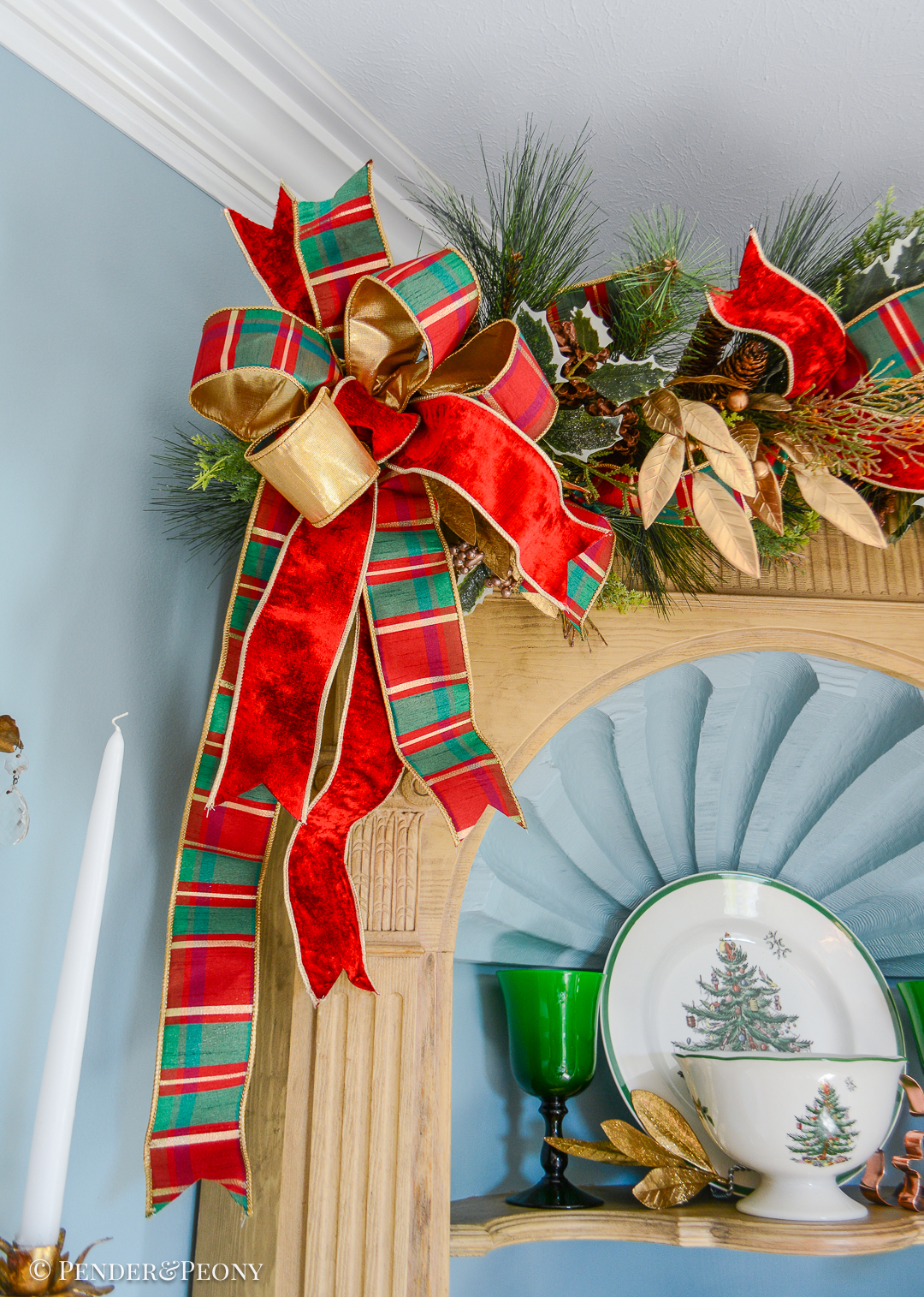 Bow made of plaid and red velvet ribbons