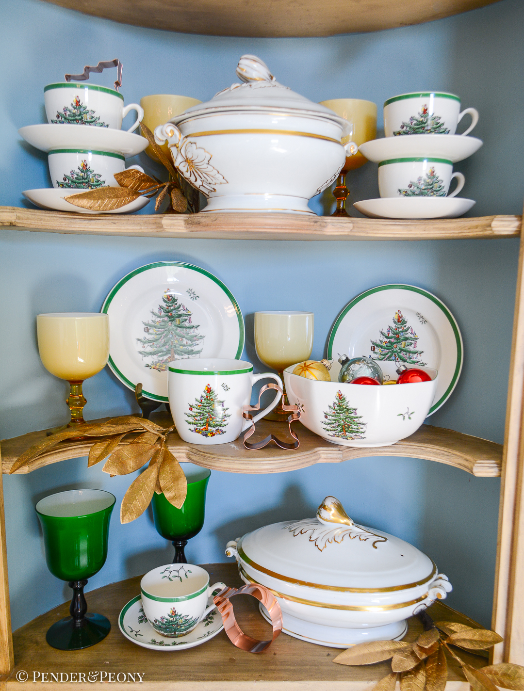 Spode Christmas tree dishes arranged in corner cabinet